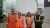 Four people standing in a line posing for photo at Manchester airport Fede
