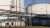 Account managers walking in front of storage tanks at Lingen Refinery
