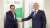 Two men shacking hands in front of air bp and Masil branded panels. Baghdad Airport joins our network