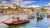 Boats on Douro river, Porto, Portugal with bridge and cityscape in background
