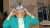 Woman wearing the 3D goggles at the NBAA