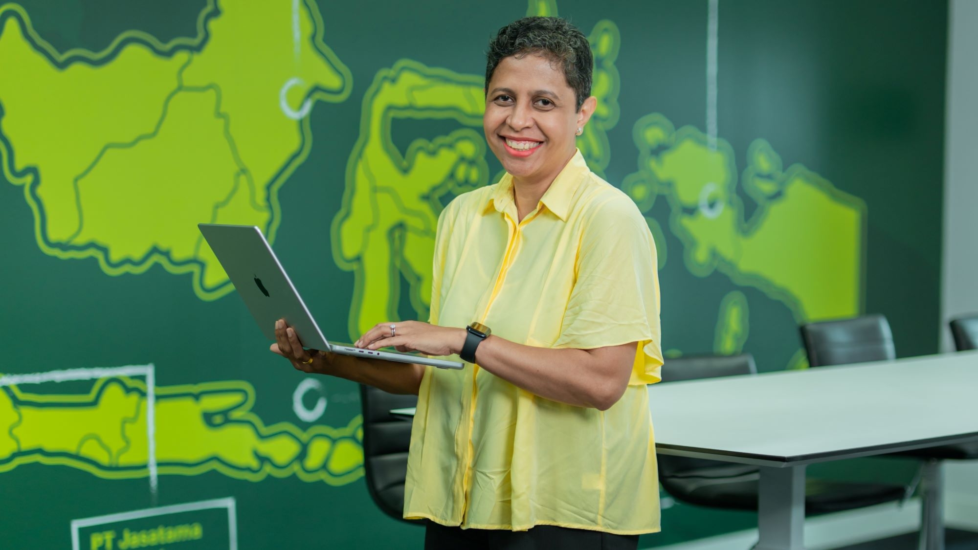 Woman holding a laptop
