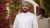 Man wearing a headscarf smiling