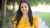 Smiling young woman in yellow blouse