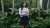 Young woman standing with her arms folded