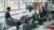 Three people in an informal meeting
