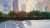 Ecological energy renewable solar panel plant with urban landscape landmarks in sunset