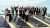Image of employees on a solar panel roof