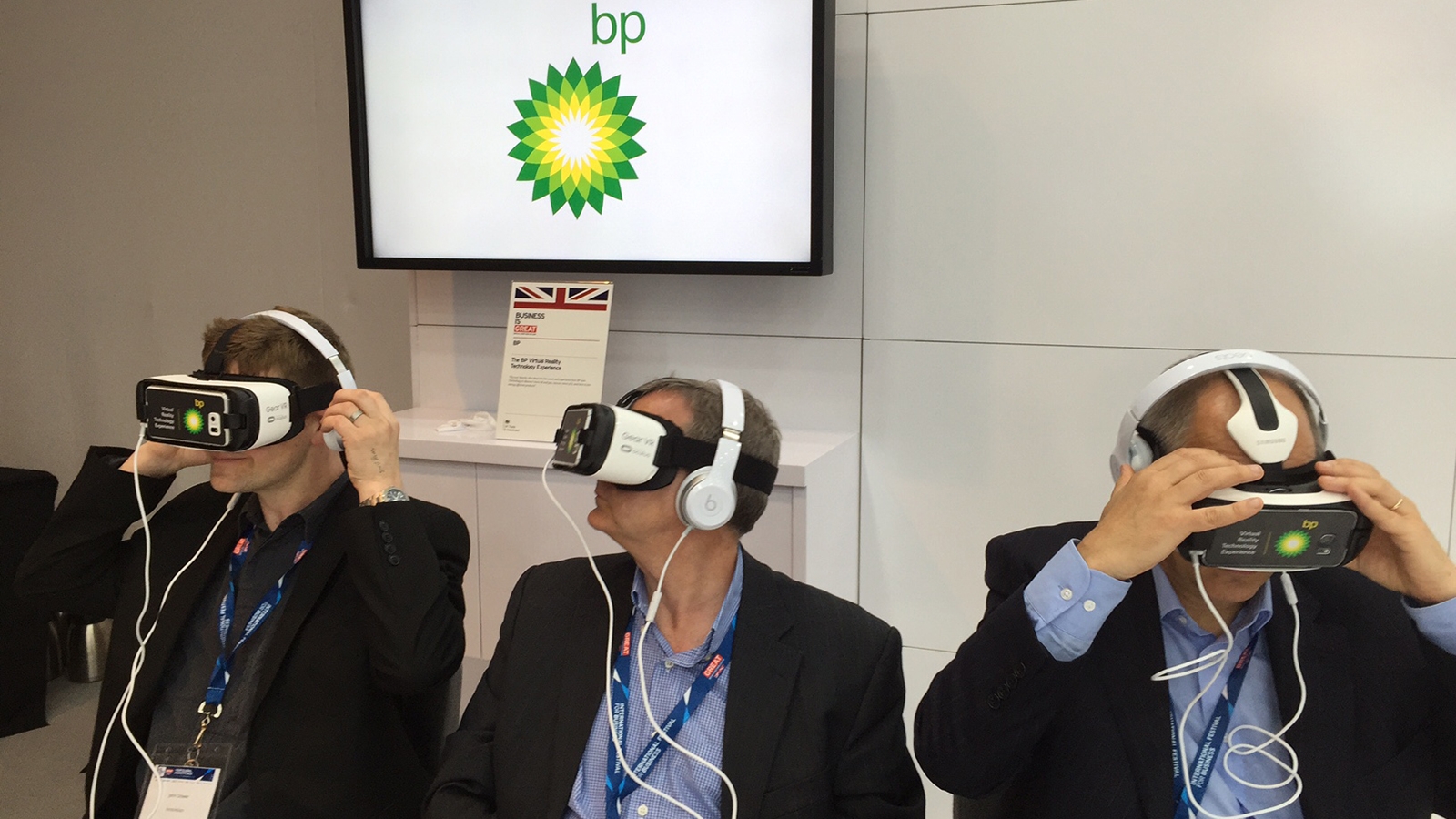 Three men wearing virtual reality headsets