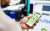 person holding a phone using the bp app