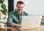 person using laptop to manage their fleet