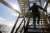 A bp team member walks up the stairs on the bp Atlantis offshore platform in the Gulf of America