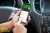 Looking at BPme rewards on cellphone in car.