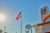 The exterior of a TravelCenters of America building with an American flag on a flagpole