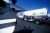 An Air BP road tanker sits on the runway with a view from under the wing and propeller of an aircraft at Oxnard Airport in USA.